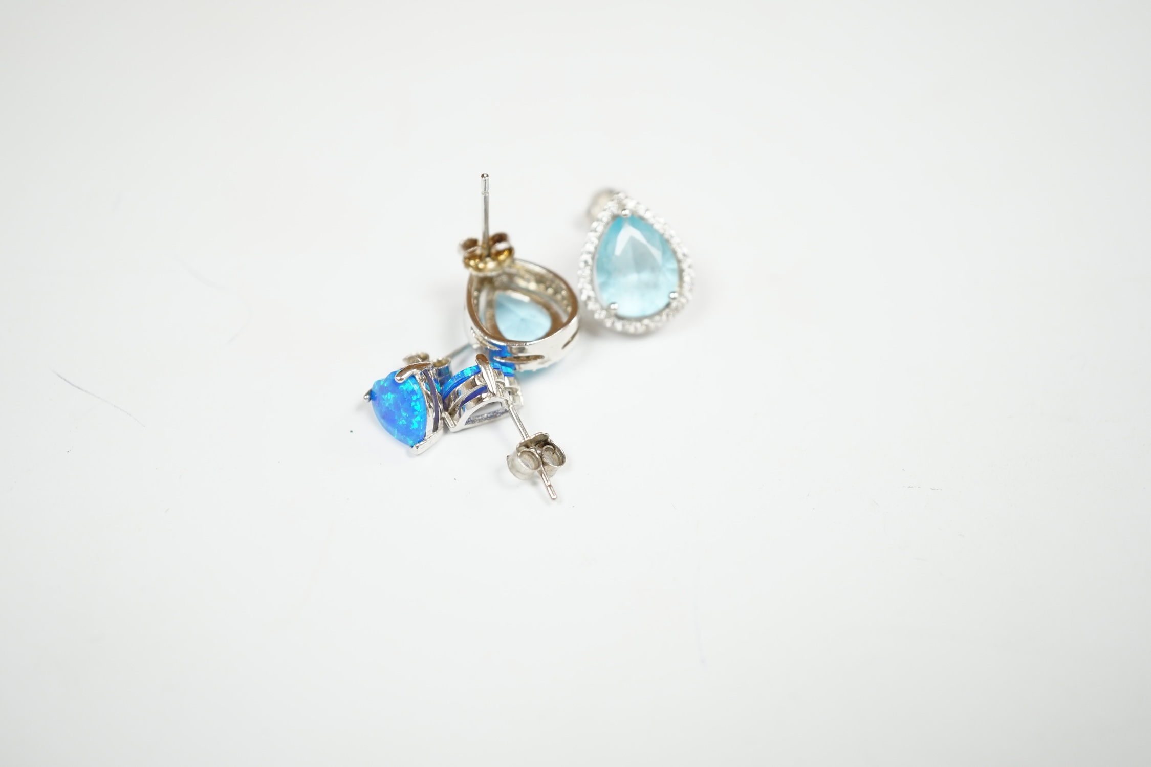 A modern 925 and simulated diamond set line necklace, 41cm, and two pairs of 925 and simulated gemstone set ear studs. Condition - poor to fair